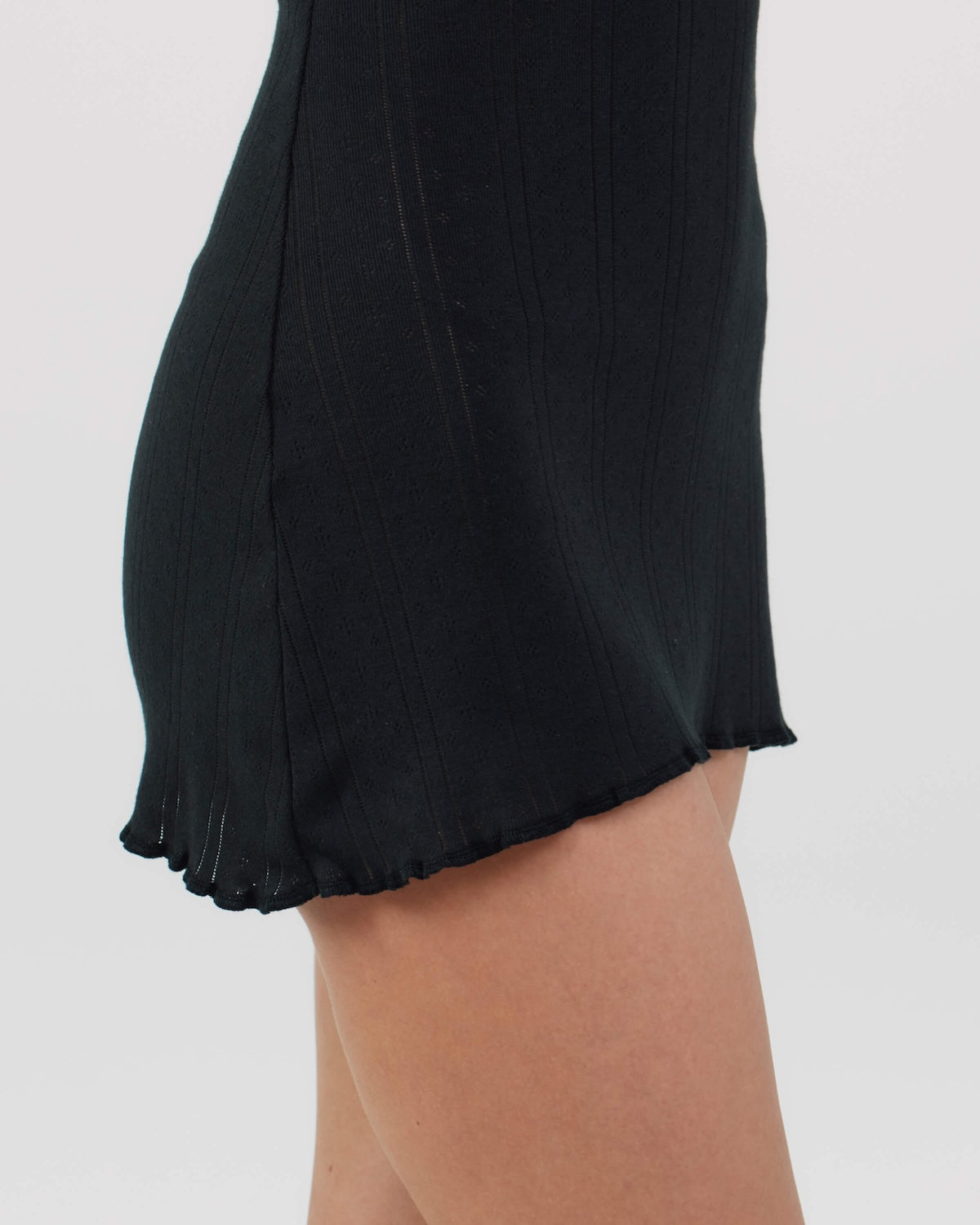 Black skirt with ruffled hem on a white background