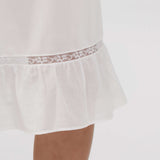 White lace-trimmed nightgown on a white background