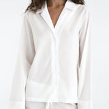 White shirt worn by a model on a white background