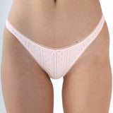 Light pink underwear with subtle pattern on a plain background