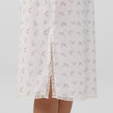 White lace nightgown with floral pattern on a light gray background